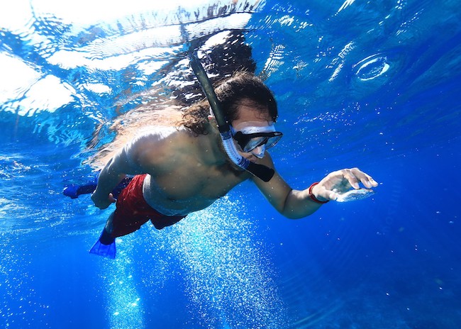 Robert watching carefully while snorkeling in the sea of Cozumel.