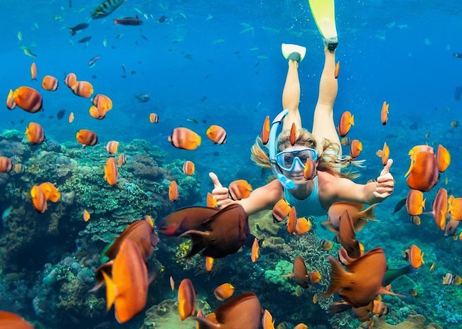 Sarah having fun on the reefs near Playa del Carmen.